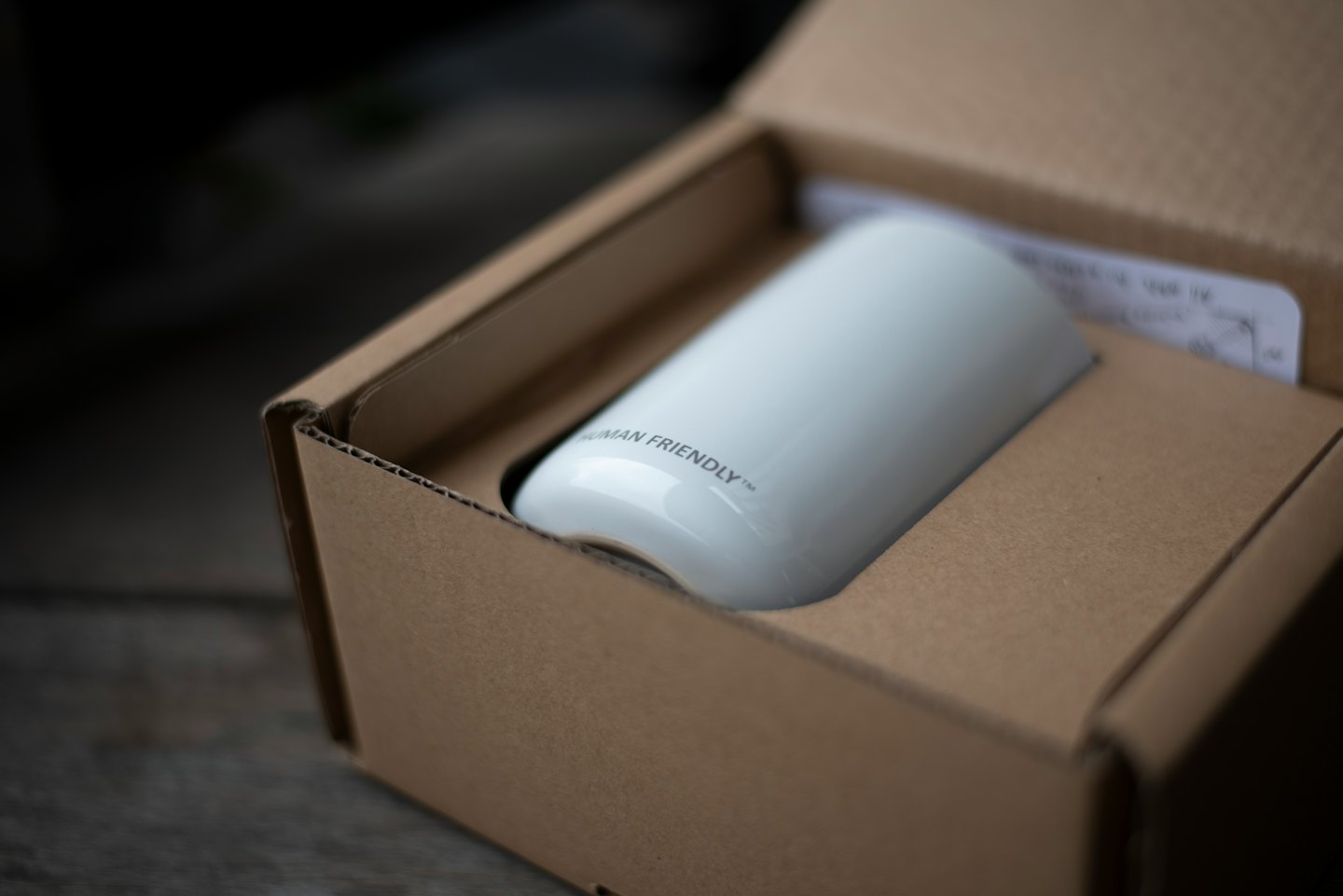 Specials A white product labeled Human Friendly resting inside cardboard packaging.