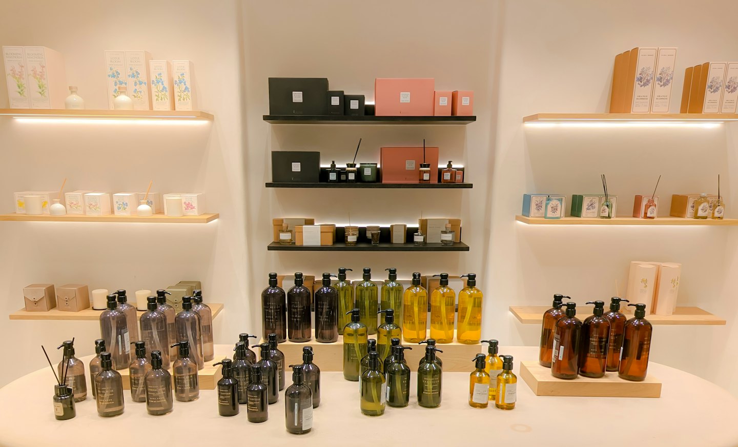 Specials Beauty products displayed on shelves and table in a store.