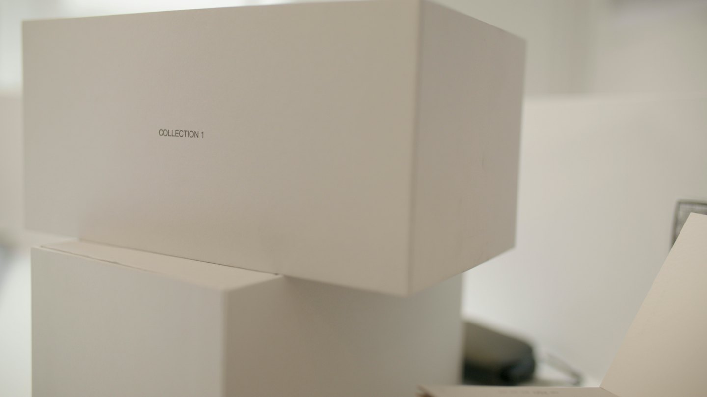 Home Two beige boxes stacked for product display.